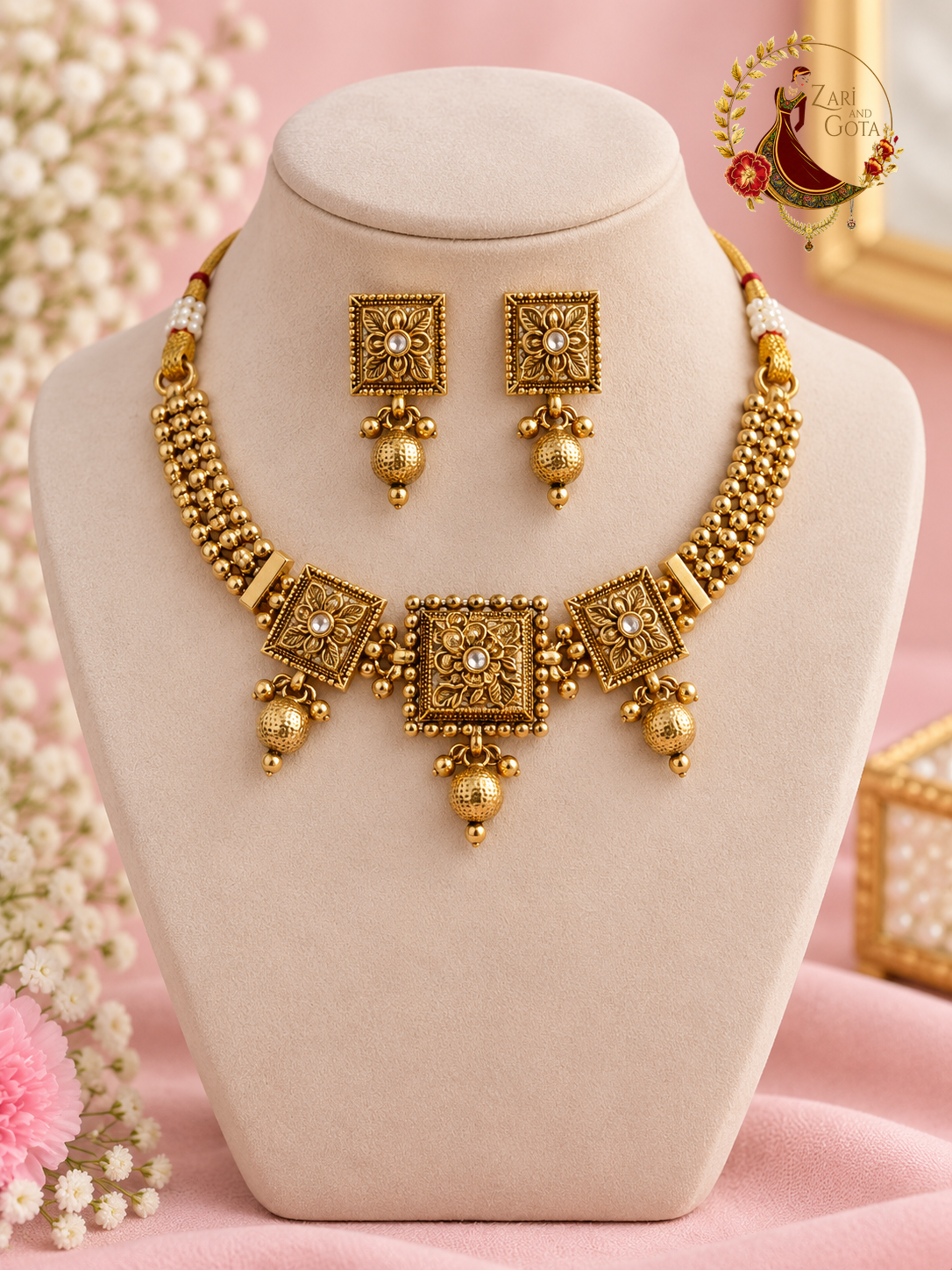 Antique gold-finish temple choker with carved square medallions and hammered ball drops, with matching studs, on a display bust, Zari and Gota UK