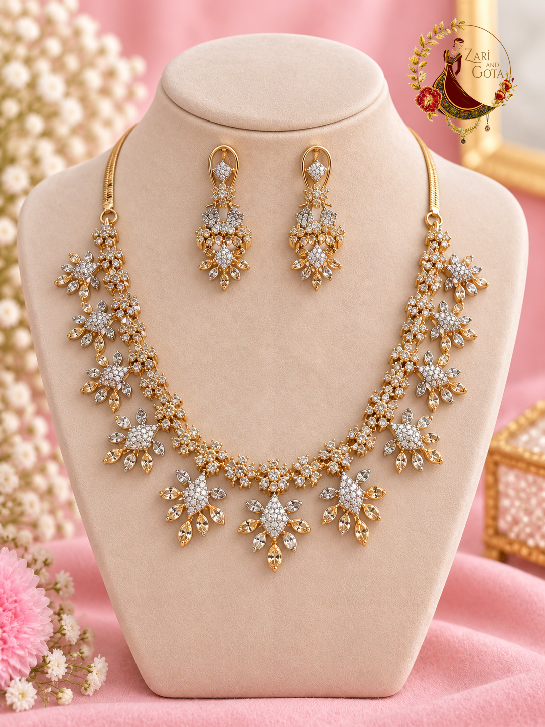 Gold-tone American diamond floral cluster necklace with matching drop earrings on a display bust, Zari and Gota UK