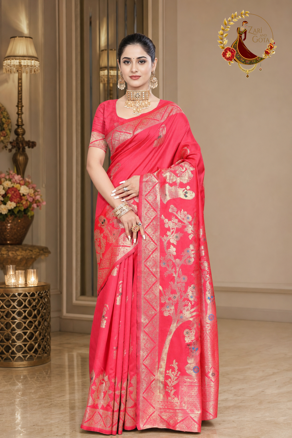 Coral pink Dola silk saree with the woven zari pallu draped forward