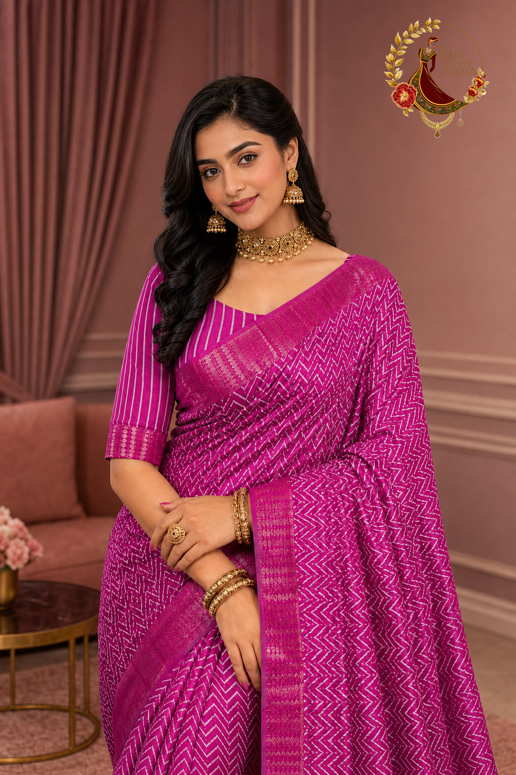 Close view of the magenta pink chevron saree blouse and gold zari border on a model