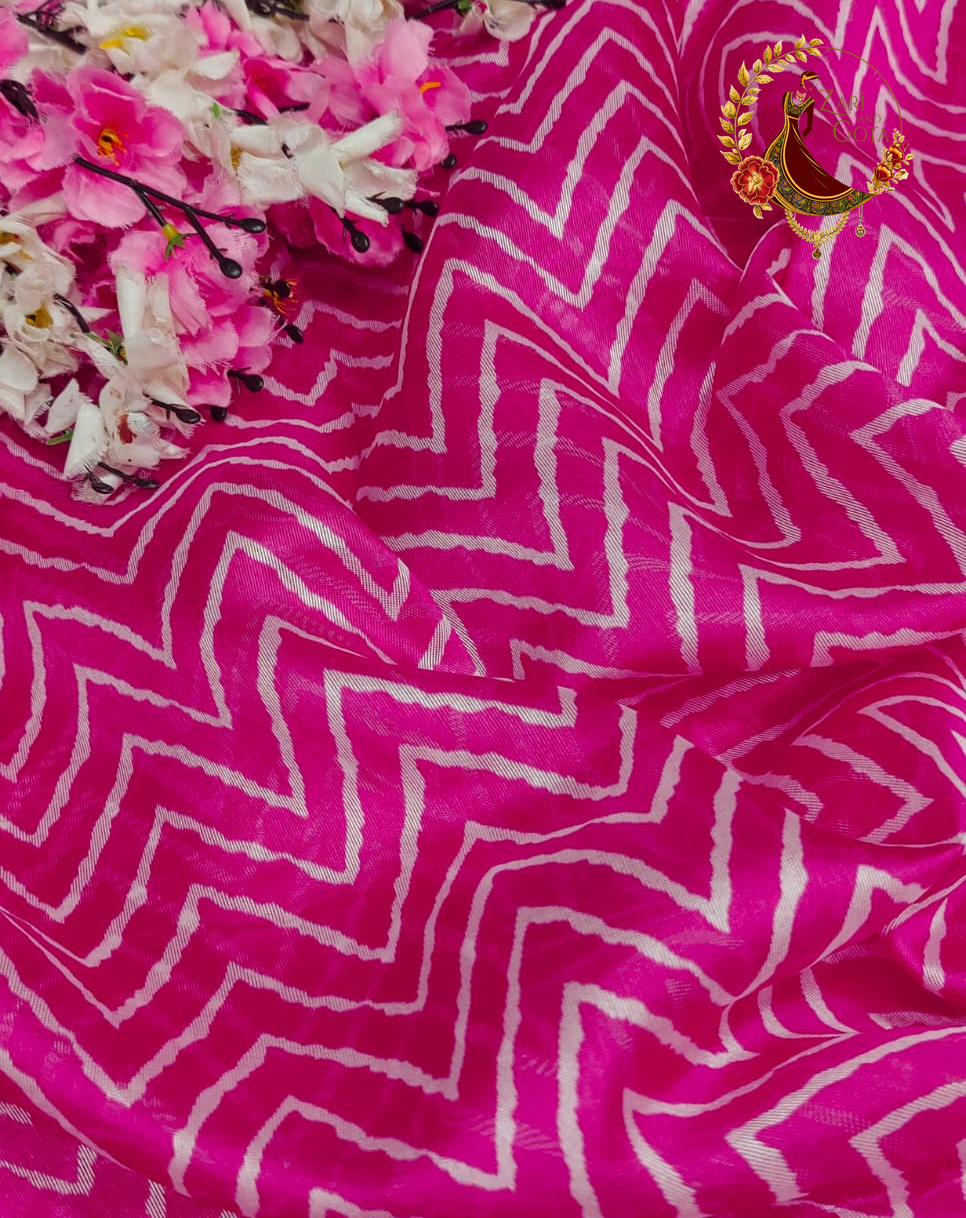 Magenta pink chevron print cotton silk saree fabric styled with flowers
