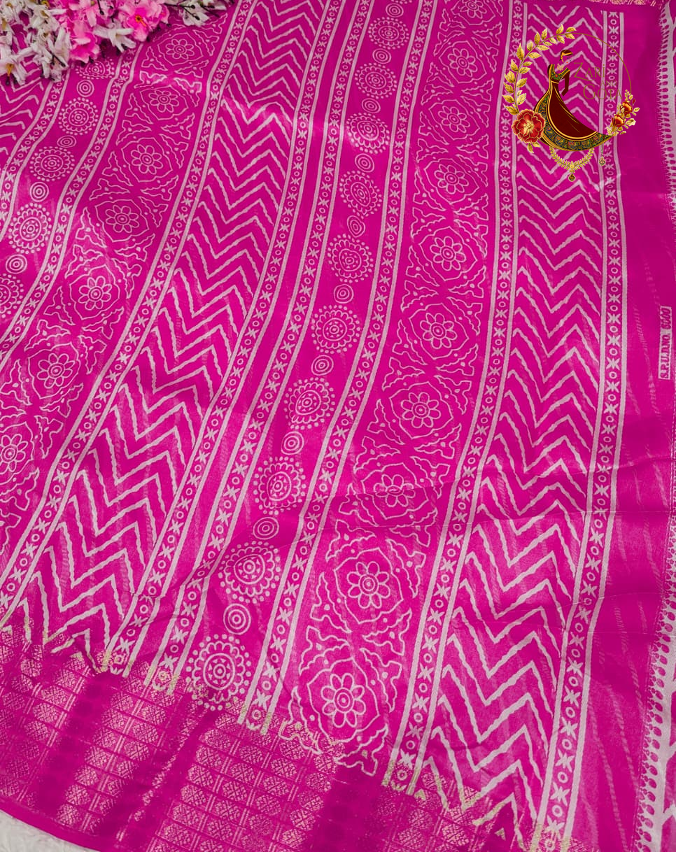 Printed motif bands running down the pallu of the magenta pink cotton silk saree