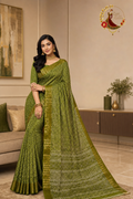 Olive green cotton silk chevron print saree with gold zari border, worn by a model