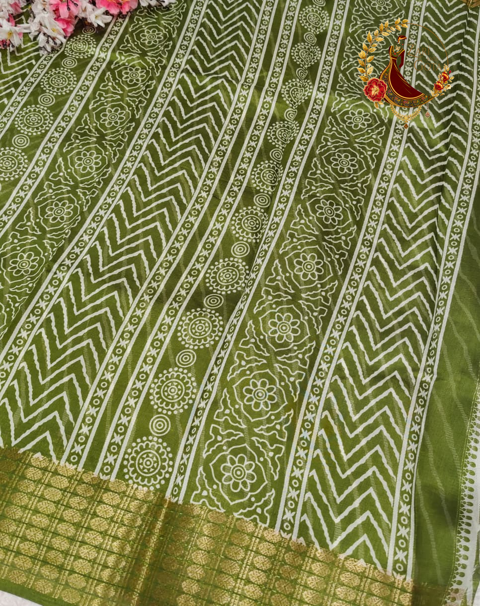 Printed motif bands running down the pallu of the olive green cotton silk saree