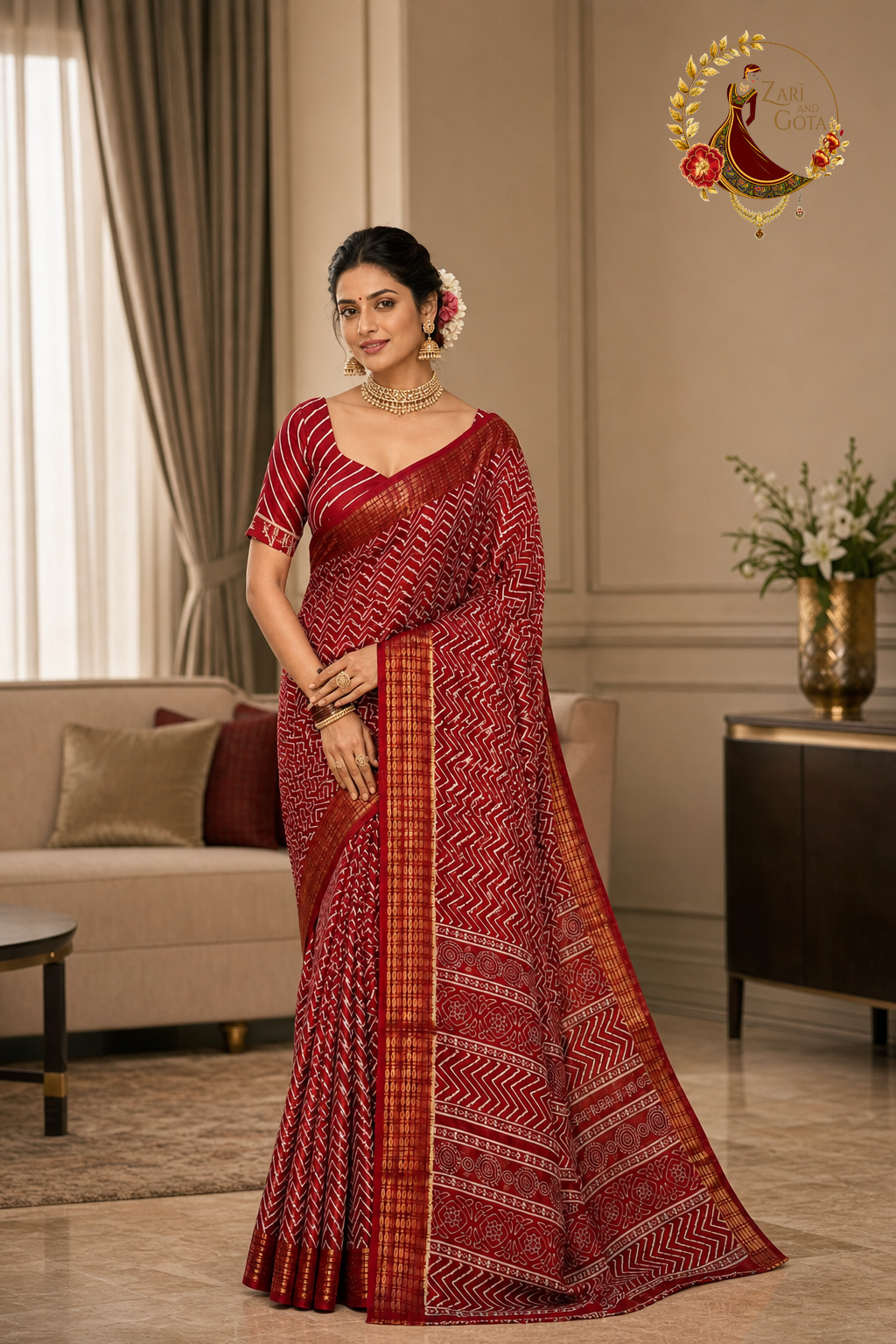 Maroon cotton silk chevron print saree with gold zari border, worn by a model