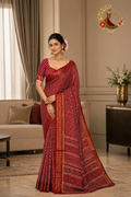 Maroon cotton silk chevron print saree with gold zari border, worn by a model