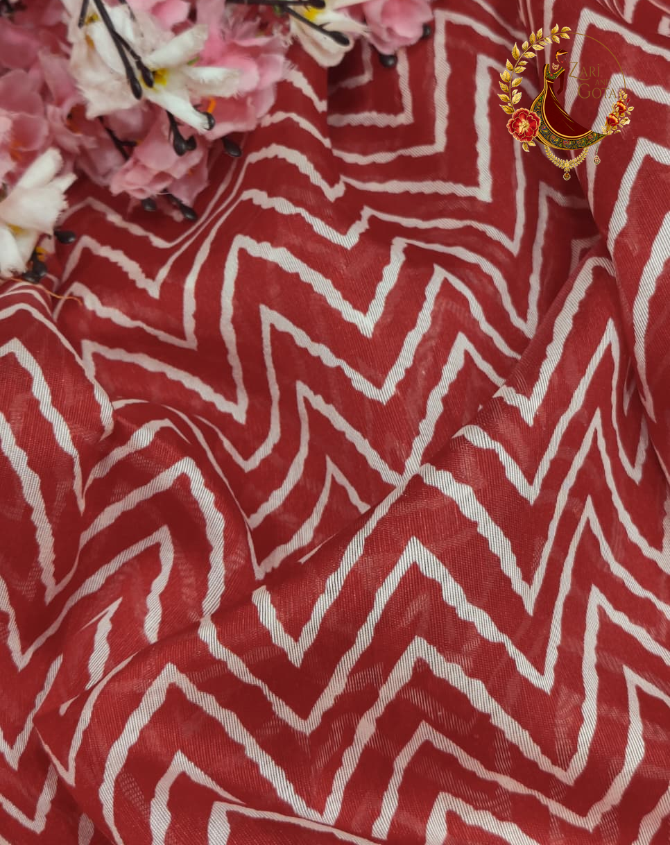Maroon chevron print cotton silk saree fabric styled with flowers