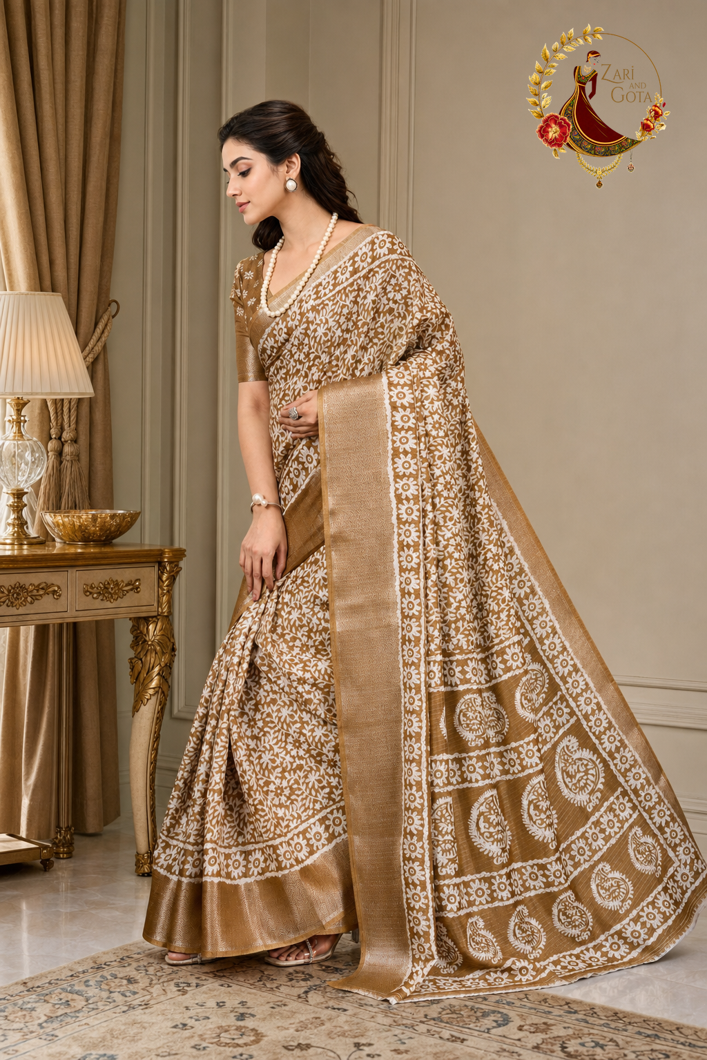 Side view of the caramel batik print saree showing the old gold zari selvedge