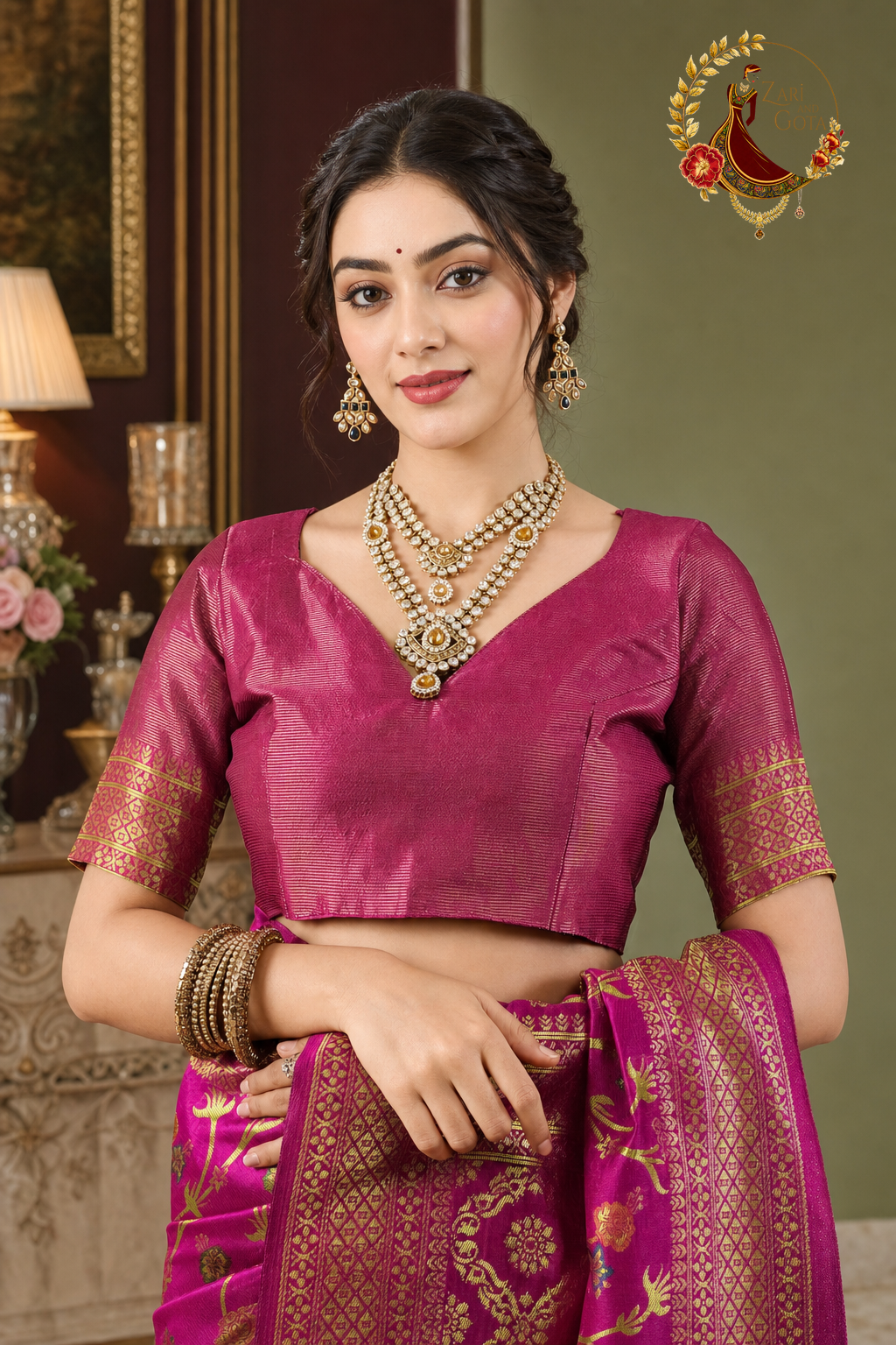 Detail of the rani pink blouse with woven gold zari sleeve band