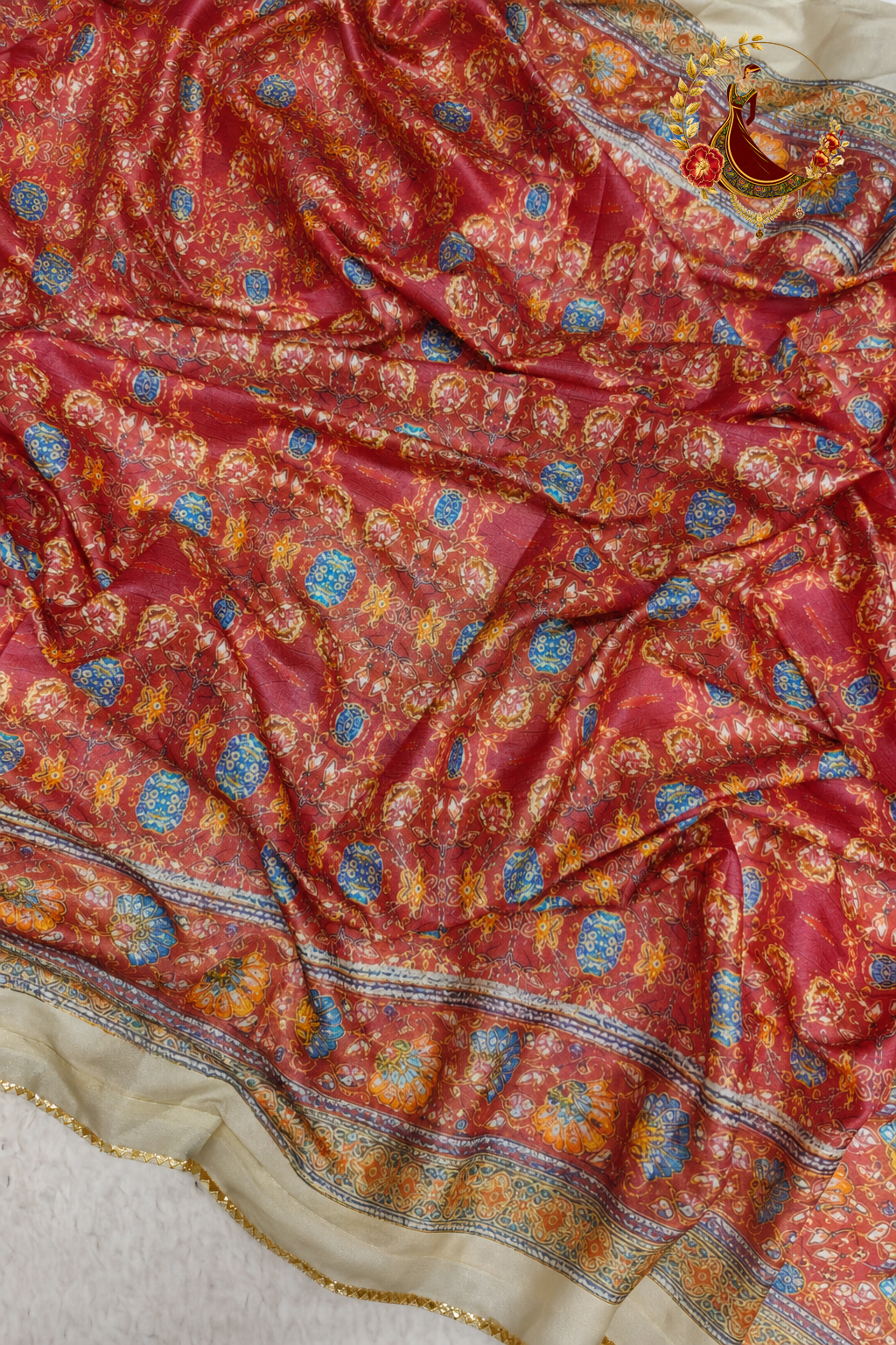 Brick red printed blouse piece supplied with the georgette saree