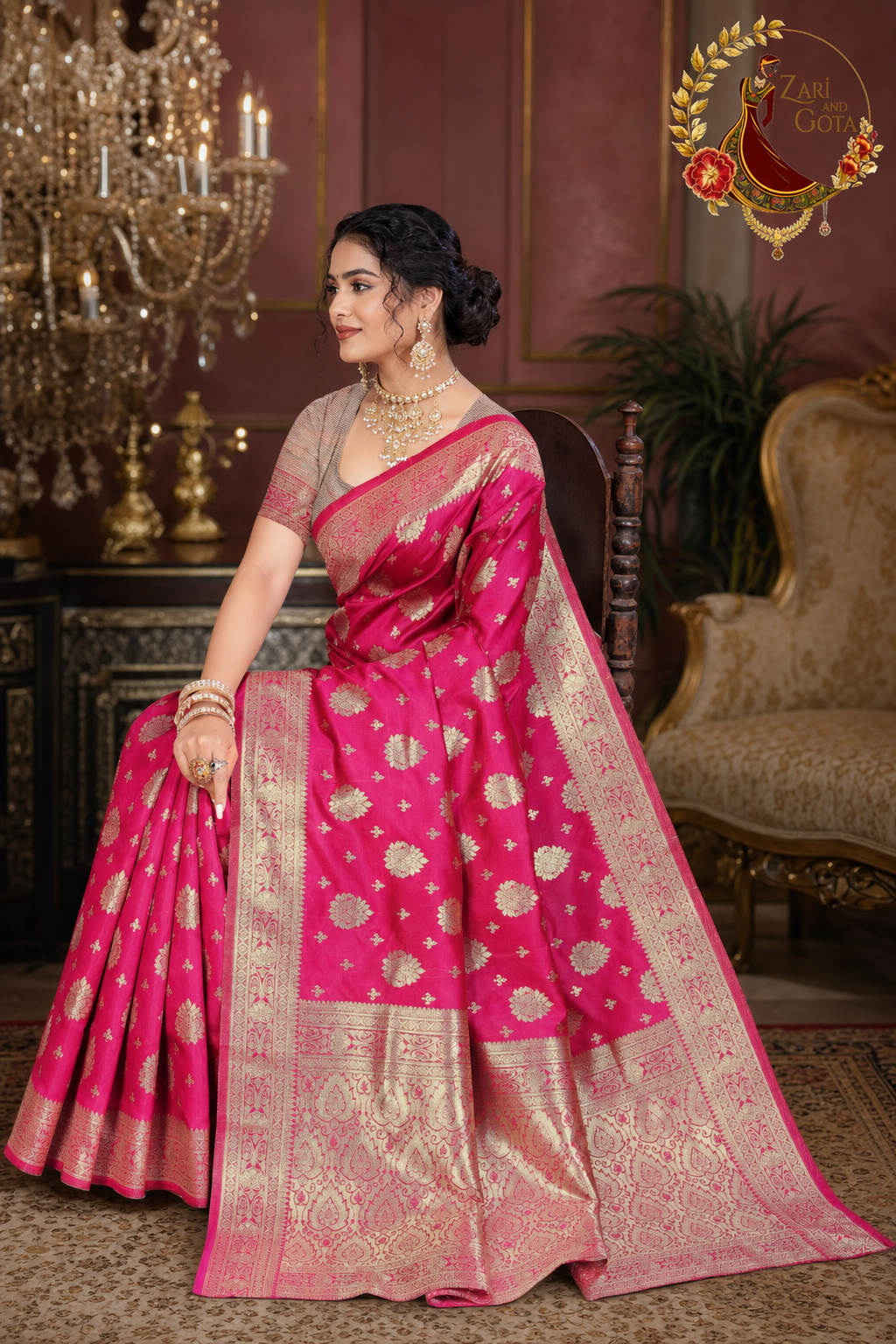 Seated view of the rani pink Dola silk saree showing the woven pallu detail