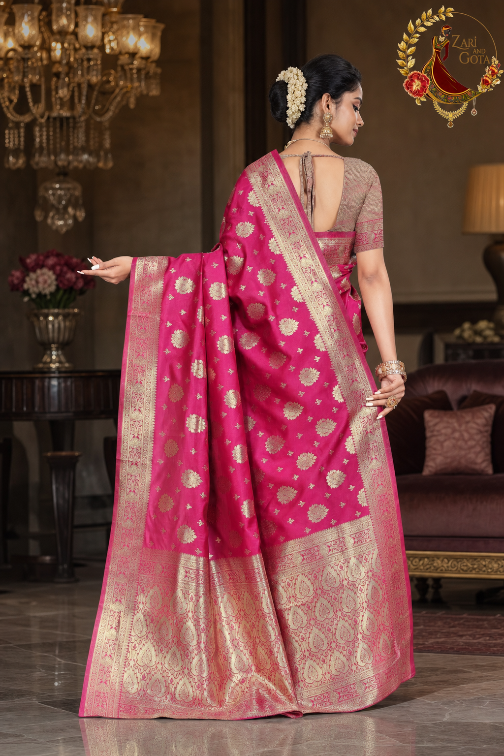 Back view of the rani pink Banarasi saree showing the full zari pallu and border