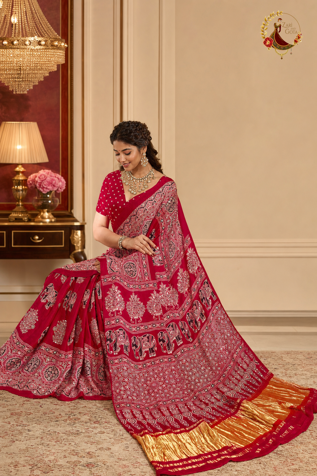Red Gaji silk saree draped and spread, showing full block print layout