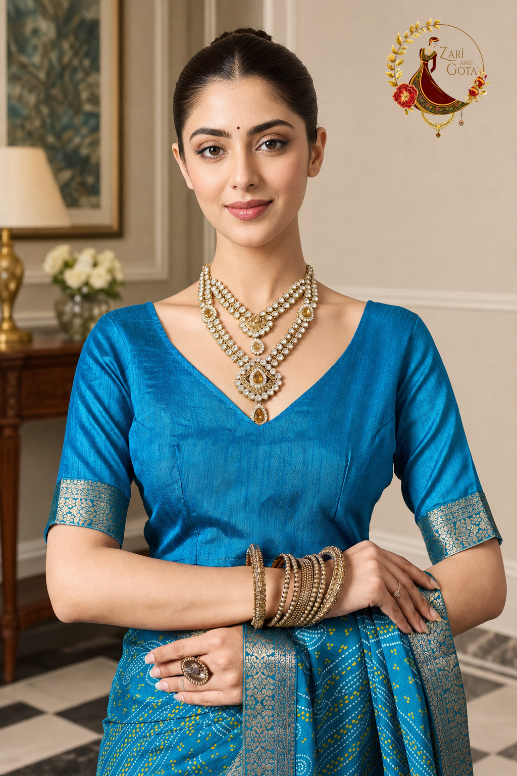 Detail of the turquoise blouse with silver-gold zari band at the neckline
