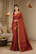 Deep red cotton silk ghatchola saree with gold zari grid, worn by a model