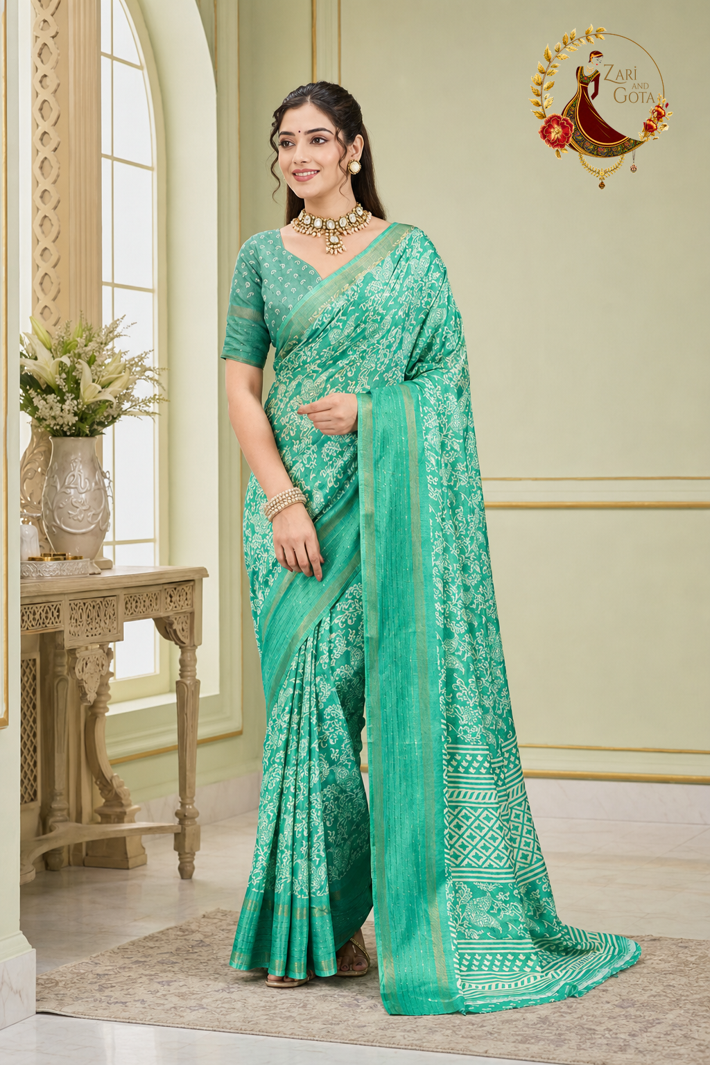 Sea green cotton silk saree with ivory batik floral print and woven zari border, worn by a model