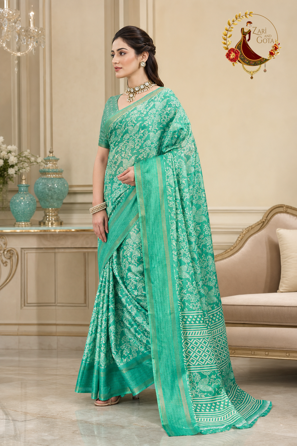 Side view of the sea green batik print saree showing the zari selvedge
