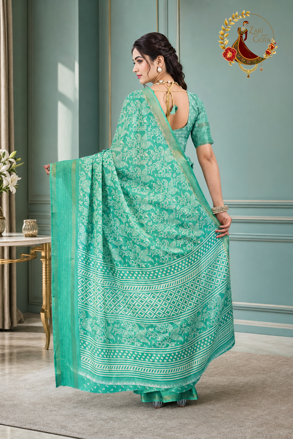 Back view of the sea green batik saree and its matching blouse