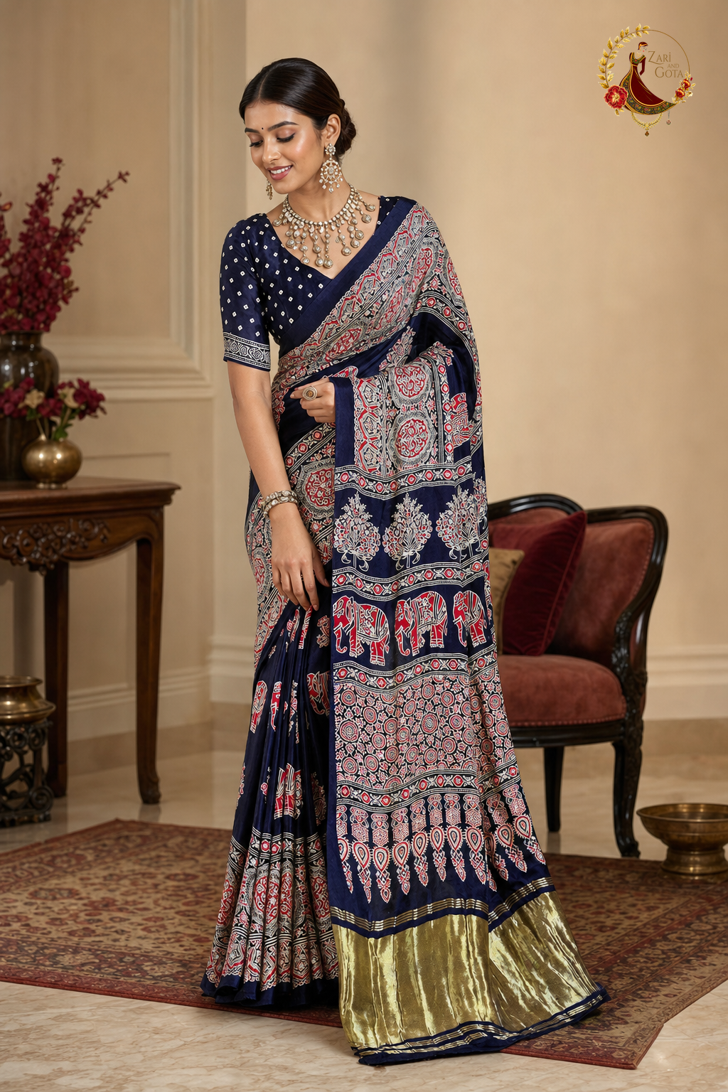 Model wearing navy Gaji silk ajrakh saree, showing pallu drape and mirror work detail