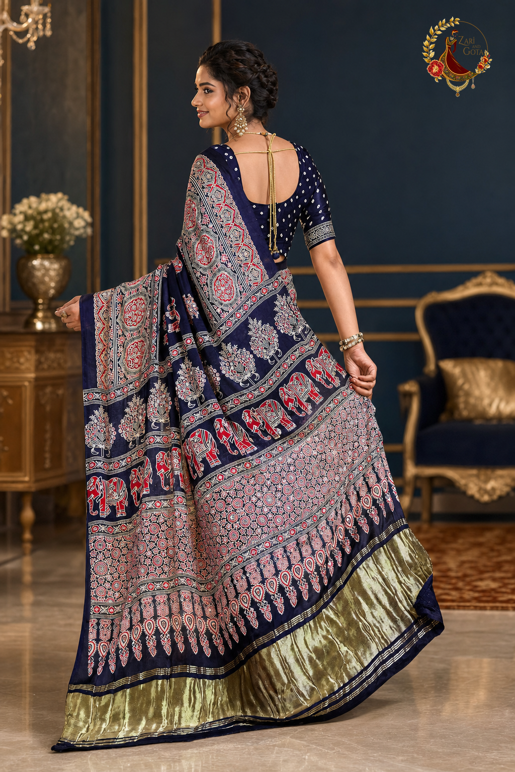 Back view of navy ajrakh saree showing pallu spread and gold-green tissue border