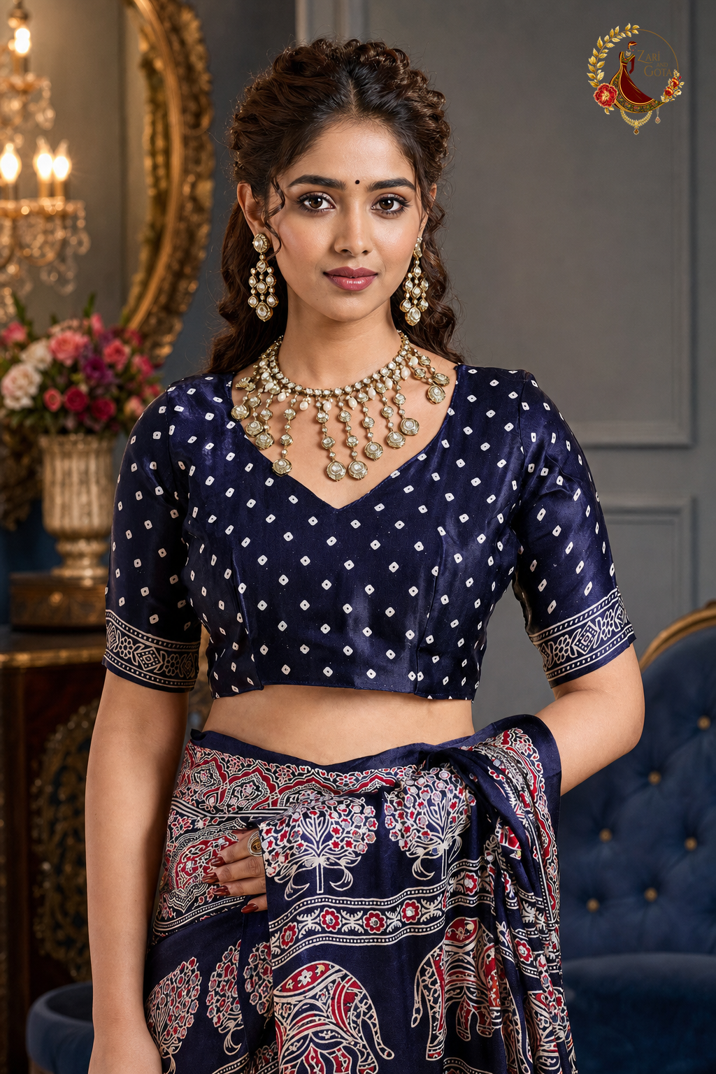 Detail of navy bandhani print blouse piece with gold sleeve band on ajrakh saree
