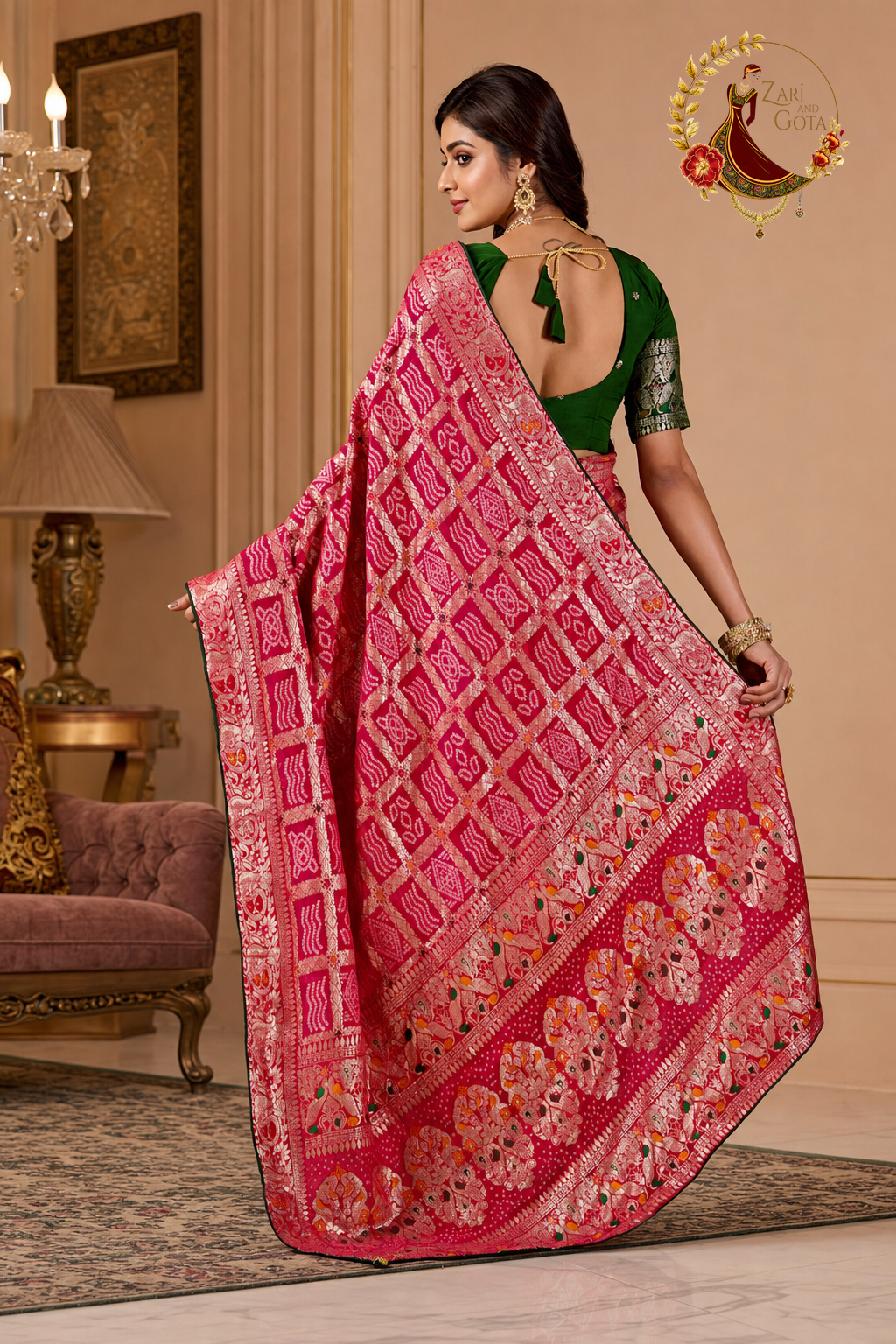 Back view of pink ghatchola saree showing the zari banded pallu spread out