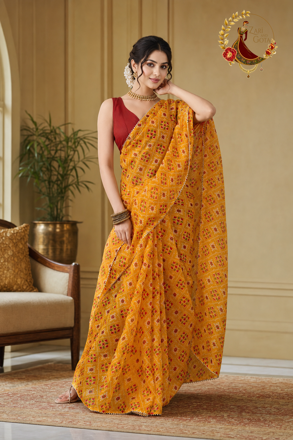 Marigold yellow patola print saree with the pallu over the shoulder