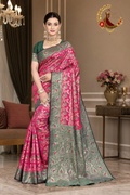 Rani pink Banarasi silk saree with sage green zari contrast border, worn by a model