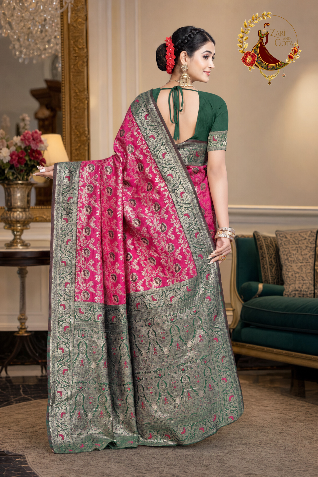 Back view of the rani pink saree and its woven sage green pallu panel