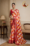 Red and orange leheriya check cotton silk saree with gold foil motifs, worn by a model