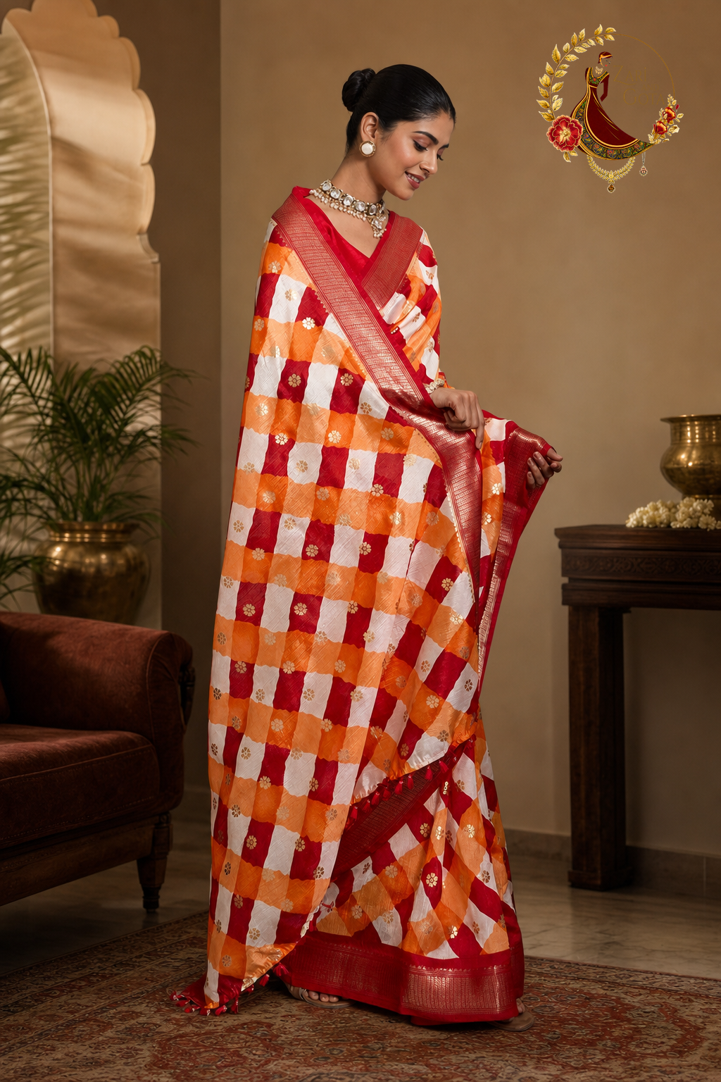 Model holding the pallu of a red and marigold leheriya cotton silk saree
