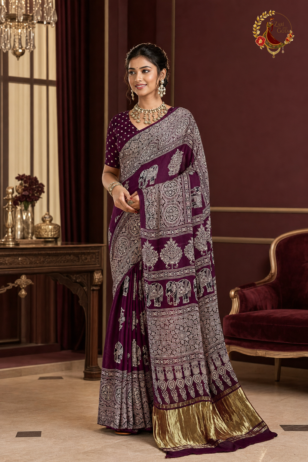 Deep plum Gaji silk ajrakh saree with ivory elephant print and gold tissue border, worn by a model