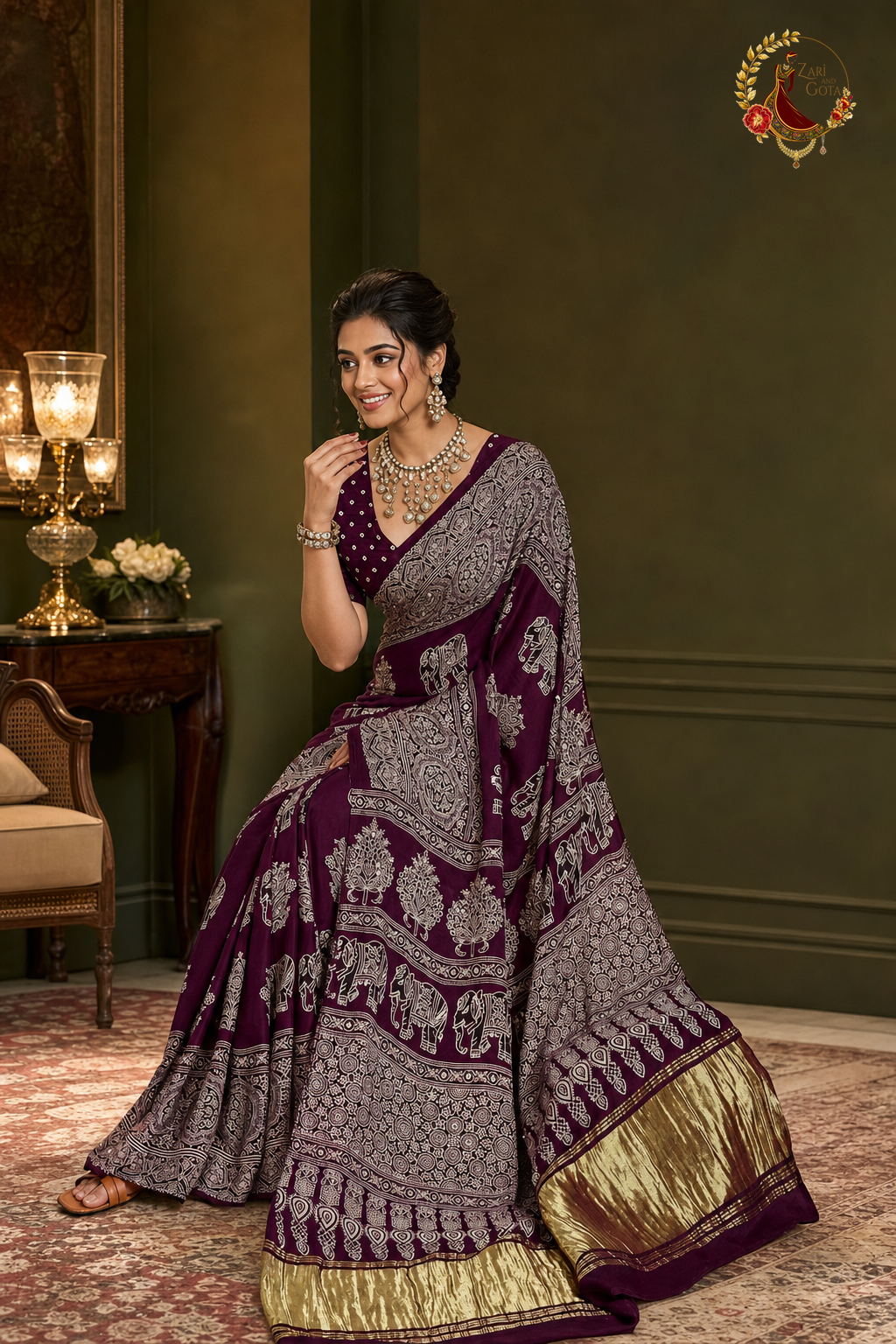 Plum ajrakh saree with ivory print and bandhani blouse piece, side view
