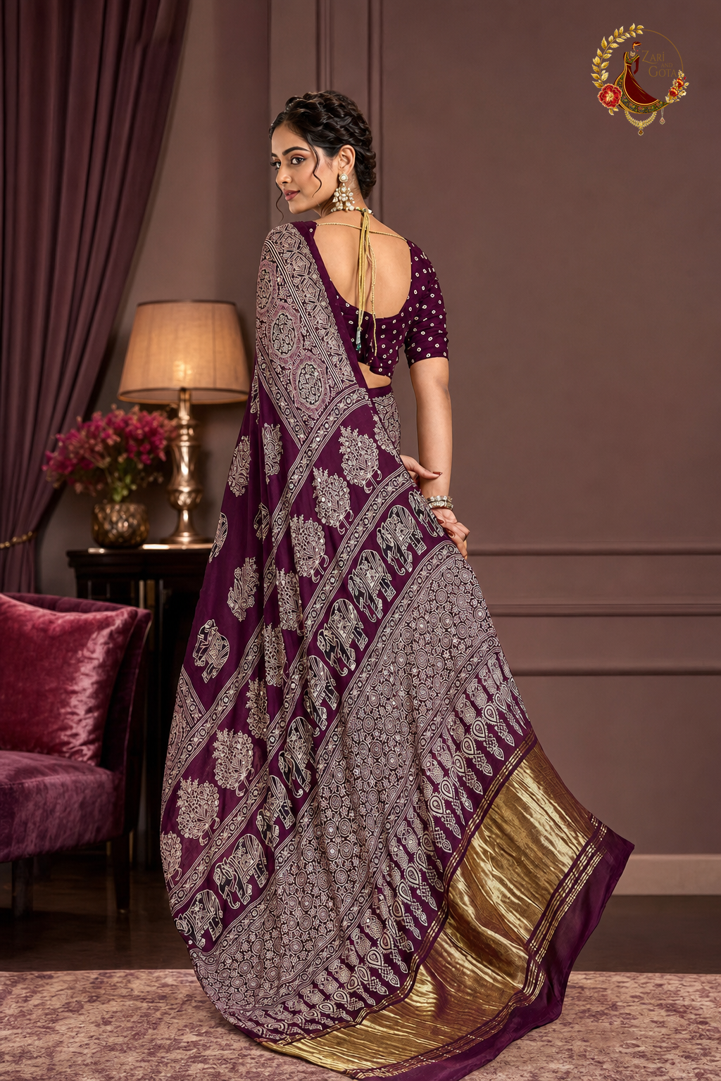 Back view of plum Gaji silk ajrakh saree showing full pallu and gold tissue border