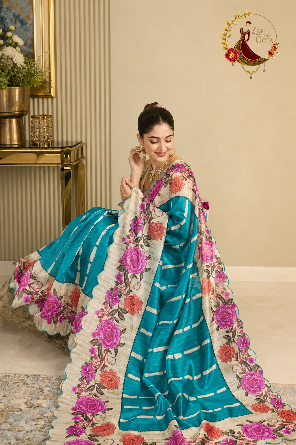 Teal tissue silk floral print saree, seated with the floral border and pallu spread out