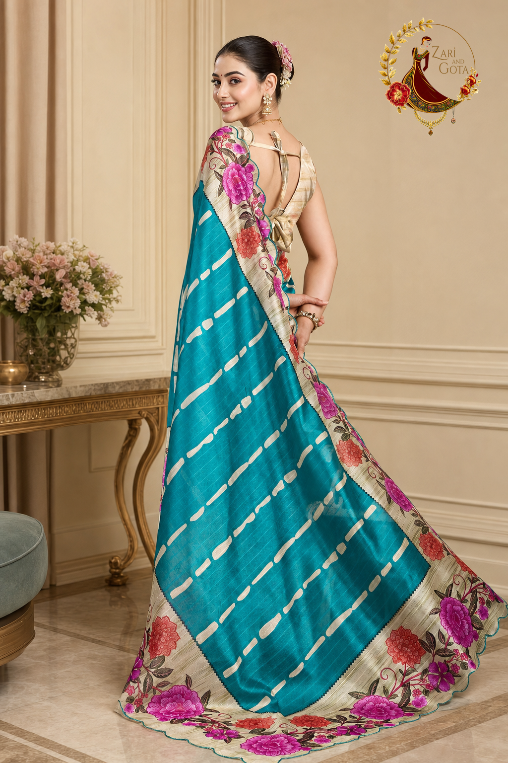 Teal tissue silk floral print saree, back view showing the pallu drape and cut-work border