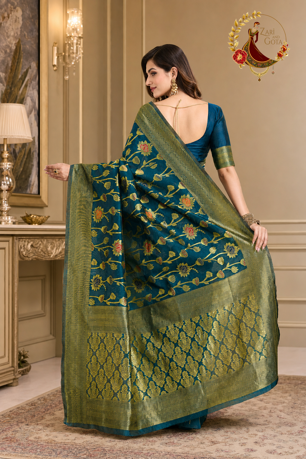 Back view of the teal zari saree showing the woven pallu panel