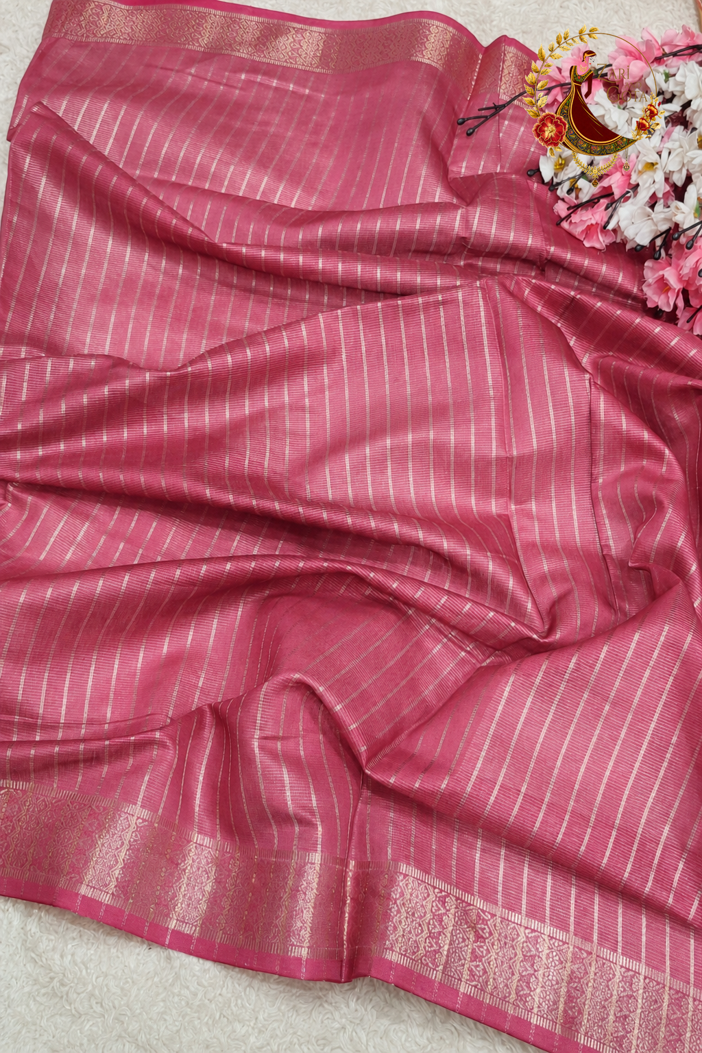 Rose pink blouse piece with silver zari stripes supplied with the saree