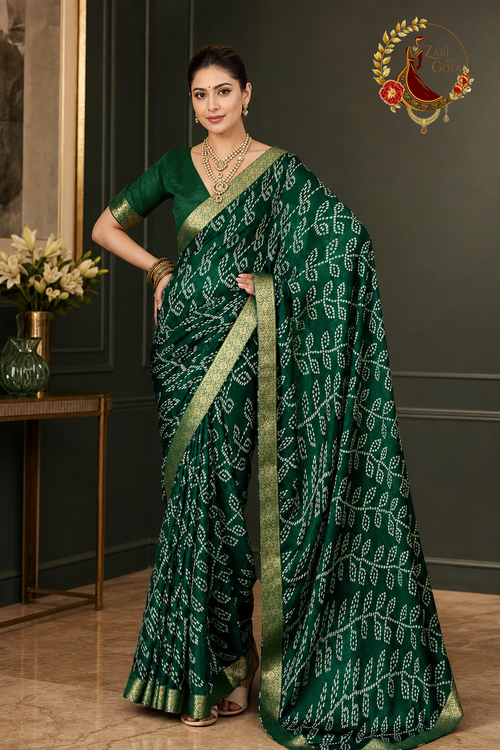 Bottle green moss chiffon saree with ivory bandhani print and gold zari border, worn by a model
