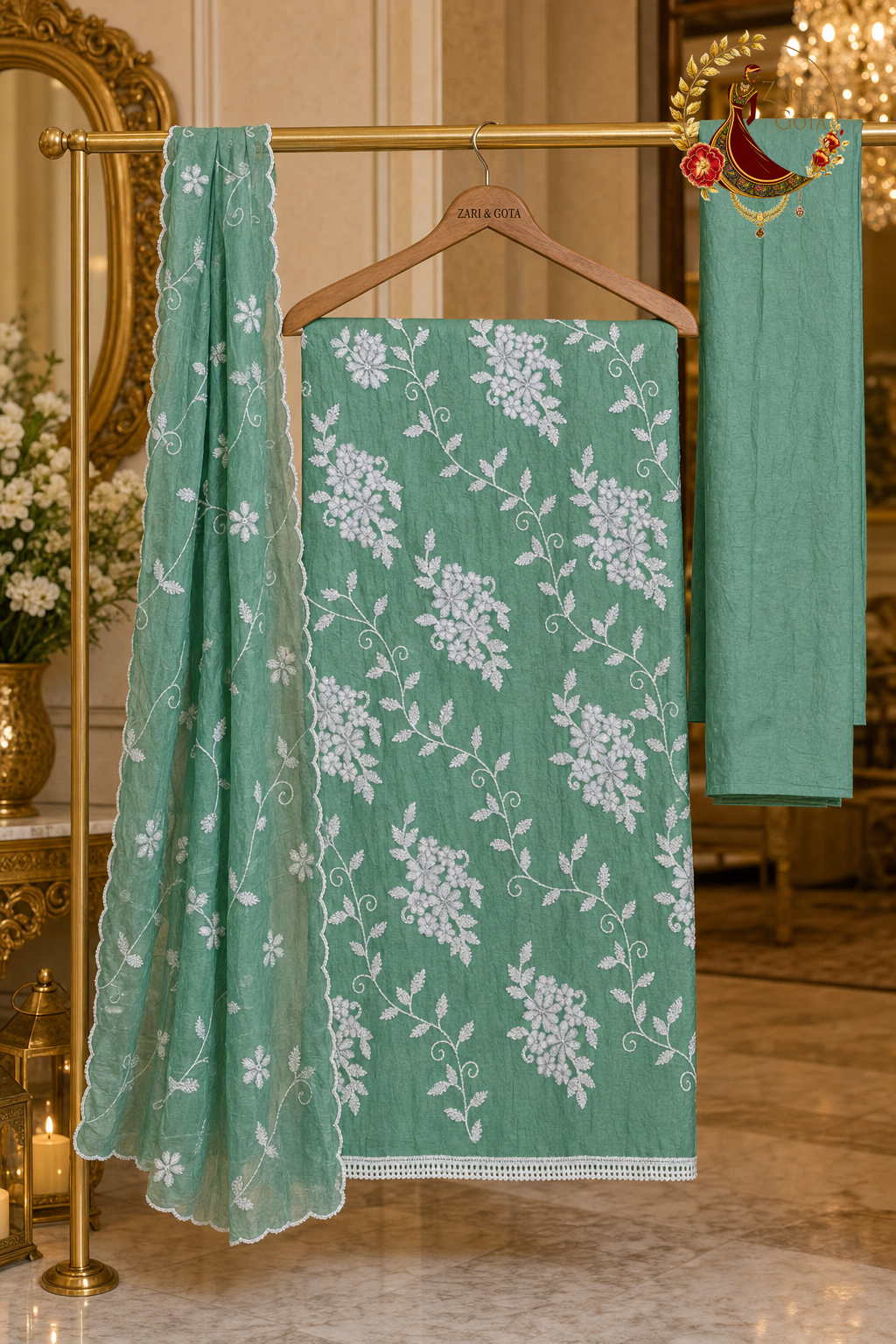 Unstitched rama green crushed cotton white thread embroidered suit set components displayed on a hanger: shirt fabric, kota dupatta and bottom