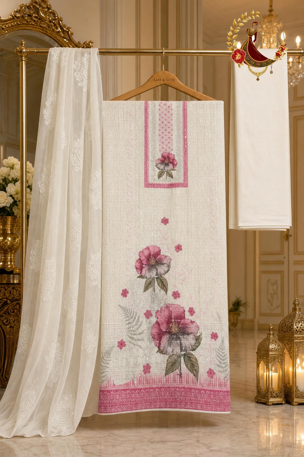 Unstitched rose pink and ivory chikankari floral print cotton suit set components displayed on a hanger: shirt fabric, chiffon dupatta and bottom