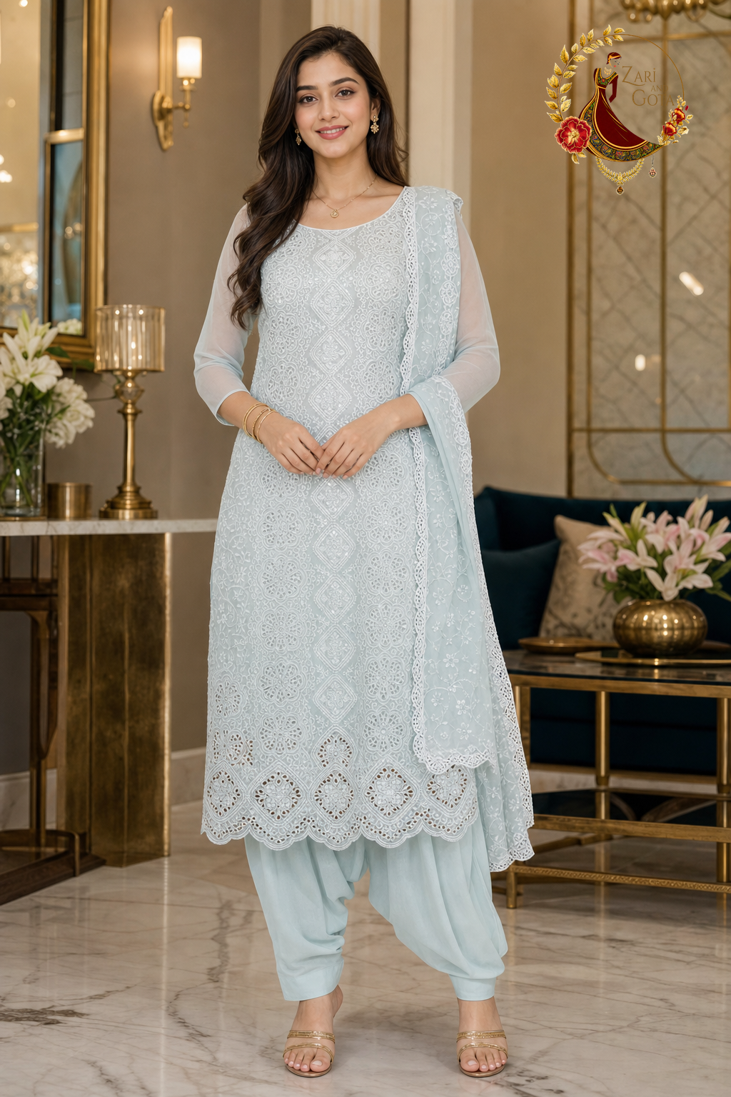 Sea blue georgette unstitched suit set with white cutwork embroidery, water sequins and cutwork-bordered dupatta, worn by a model with Punjabi salwar, Zari and Gota UK