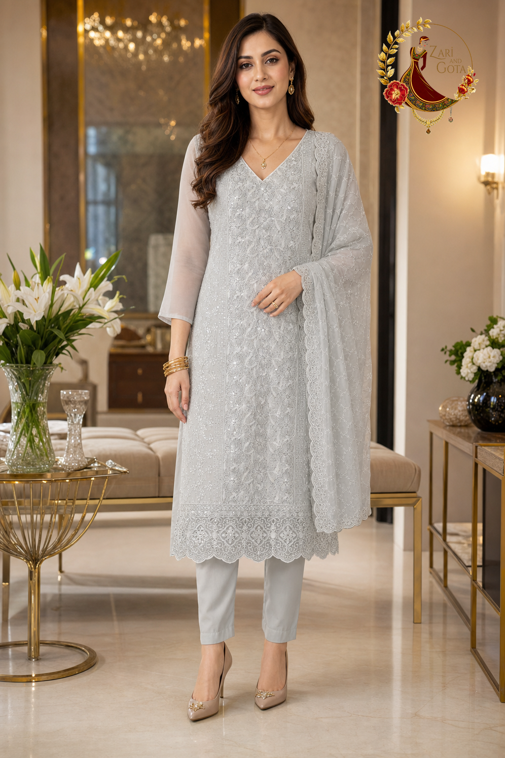 Dove grey georgette unstitched suit set with stone-studded cutwork embroidery, scalloped lace hem and cutwork dupatta, worn by a model, Zari and Gota UK