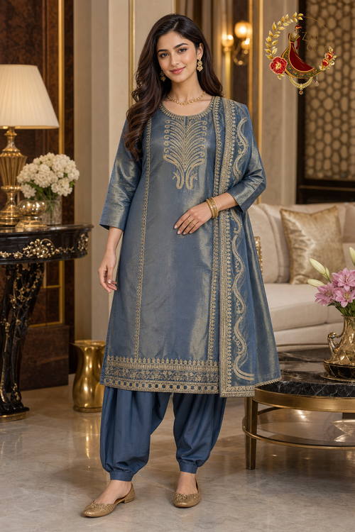Blue shimmer Jimmy Choo unstitched suit set with golden thread embroidery and gold-bordered dupatta, worn by a model with a Punjabi salwar, Zari and Gota UK