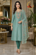 Rama green Chanderi silk unstitched suit set with multicolour thread embroidered yoke and embroidered tissue dupatta, worn by a model with a churidar, Zari and Gota UK