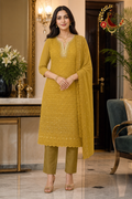 Mustard yellow georgette chikankari unstitched suit set with sequins, pearl-edged neckline and embroidered dupatta, worn by a model, Zari and Gota UK