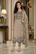 Golden coffee silk unstitched suit set with black-outlined gold rose embroidery, squared yoke, cutwork hem and dupatta, worn by a model, Zari and Gota UK