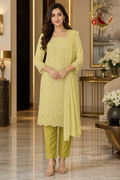 Lemon yellow georgette unstitched suit set with tonal cutwork chikankari, water sequins and scalloped dupatta, worn by a model, Zari and Gota UK