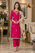 Magenta crepe unstitched suit set with sequin, pearl and cutdana neckline and beige floral-printed Chanderi dupatta, worn by a model, Zari and Gota UK