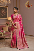 Rani pink Dola silk saree with dense gold zari weaving, worn by a model